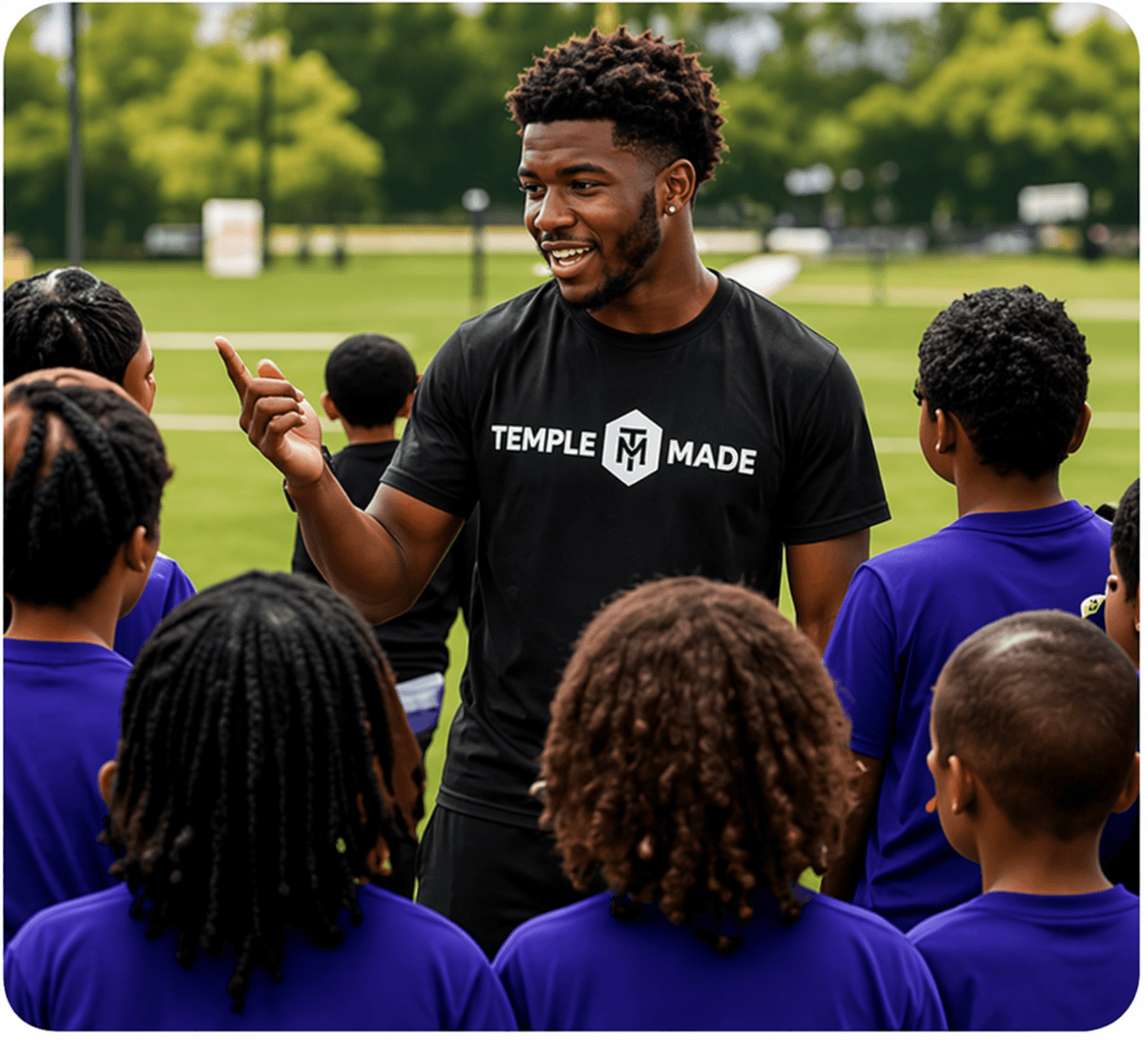 A Temple Made coach encouraging young participants outdoors
